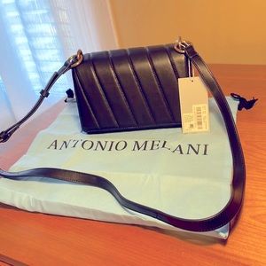 Antonio Melani.  NWT black leather crossbody. Comes with dust bag.